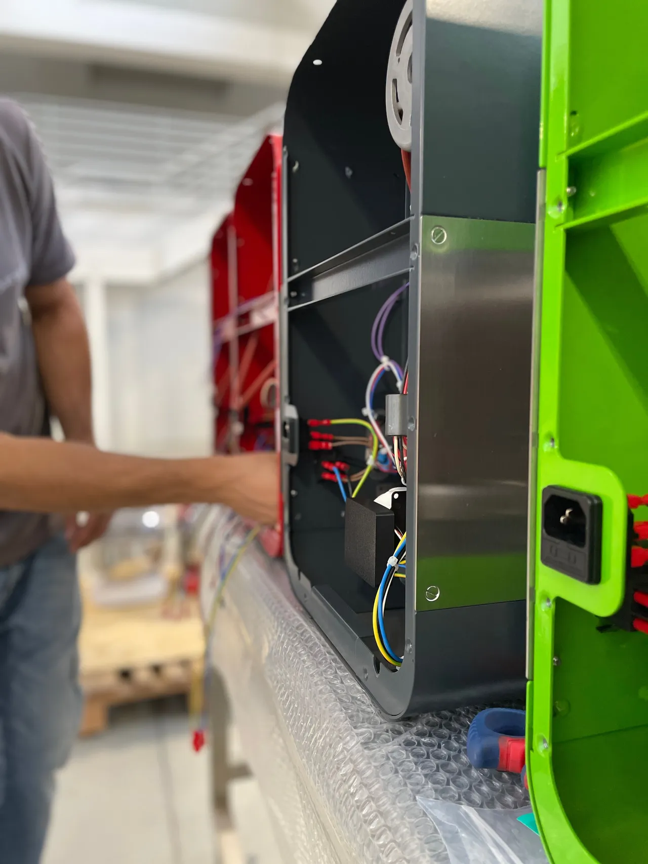 The internal wiring of a My Miss Baker unit, access panel open, during assembly.